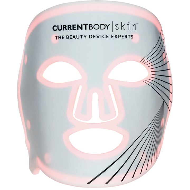 Currentbody Skin LED Light Therapy Face Mask Series 1 anti-aging hvit maske i silikon med rosa lys og sorte linjer