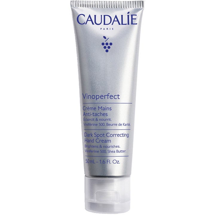 Caudalie Vinoperfect 50 ml nærende håndkrem mot mørke flekker i sølvfarget tube med gjennomsiktig kork.