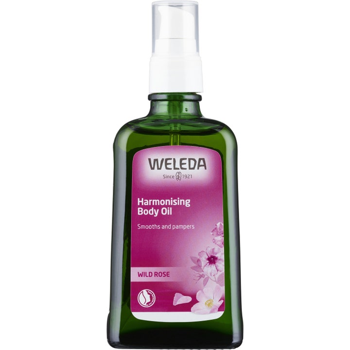 Weleda Harmonising Body Oil 100 ml pleiende kroppsolje i grønn glassflaske med hvit spraypumpe.