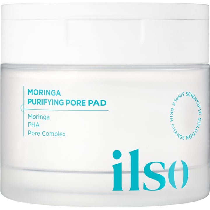 ilso Moringa Purifying Pore Pad eksfolierende pads som renser porer i en frostet hvit krukke med turkis logo
