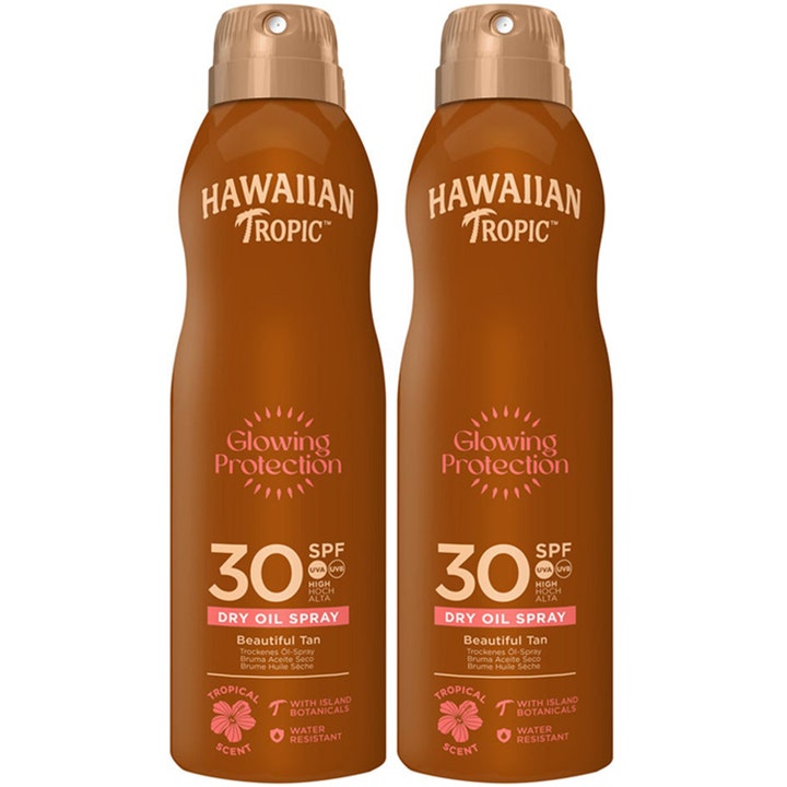 Hawaiian Tropic Glowing Protection Dry Oil Spray SPF 30 gir glødende hud i to brune sprayflasker med gulllokk.