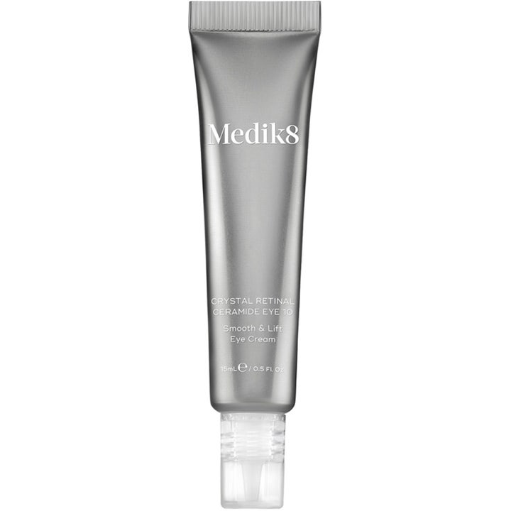 Medik8 Crystal Retinal Ceramide Eye 10 15 ml oppstrammende øyekrem i en sølvfarget tube med gjennomsiktig applikator
