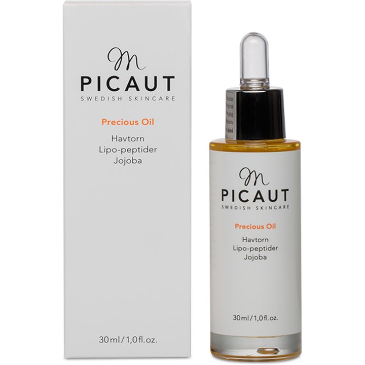 M Picaut Precious Oil 30 ml ansiktsolje med havtorn og jojoba i glassflaske med pipette ved siden av hvit eske.