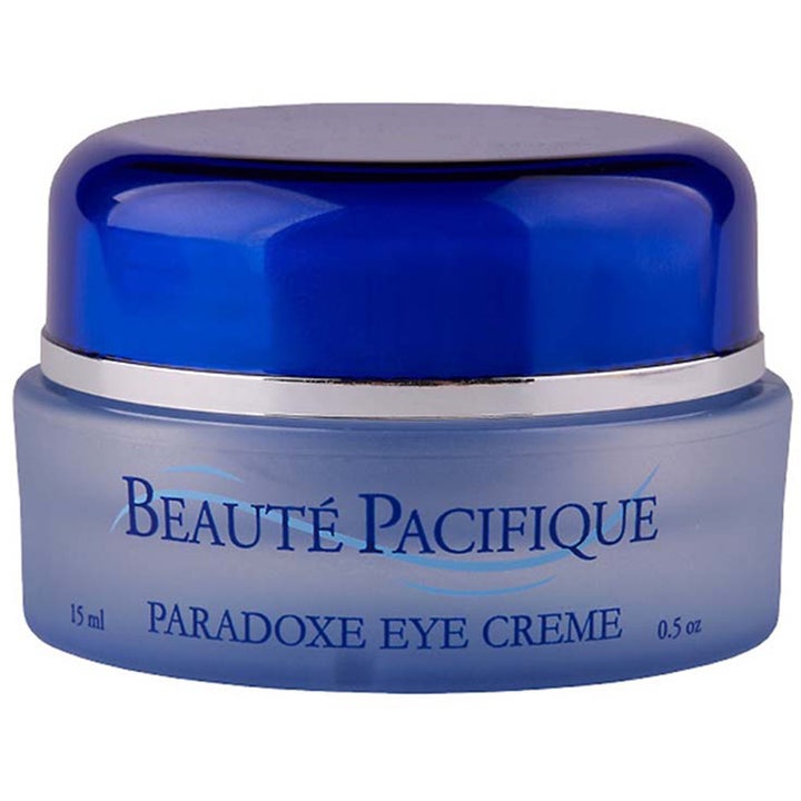 Beauté Pacifique Paradoxe Eye Creme 15 ml øyekrem som gir pleie i en frostet blå glasskrukke med mørkeblått lokk.