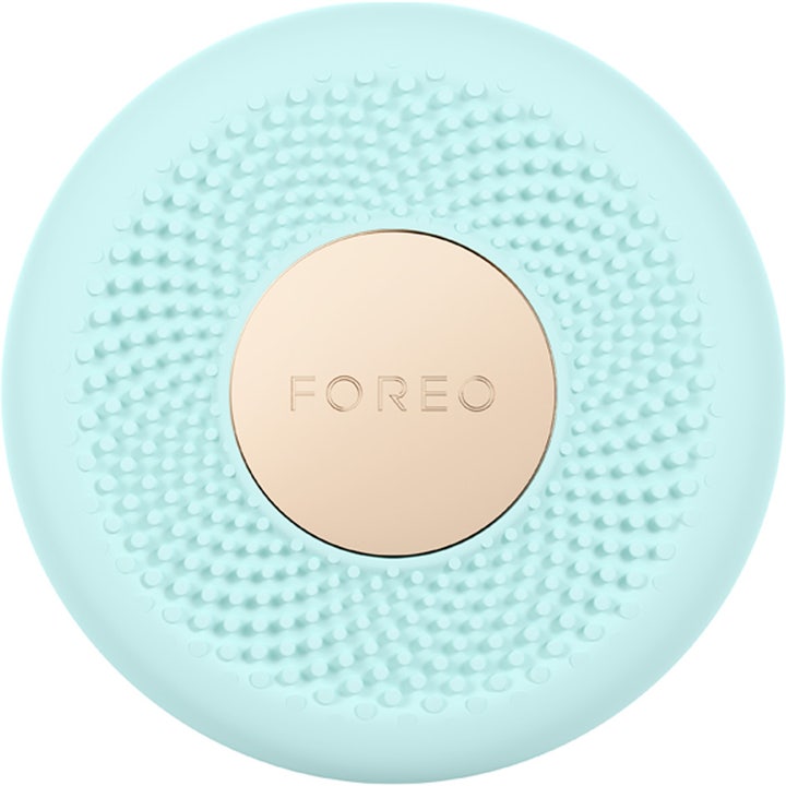 Foreo UFO smart ansiktsmaske gir glød i en rund mintgrønn silikonenhet med tekstur og gullfarget detalj