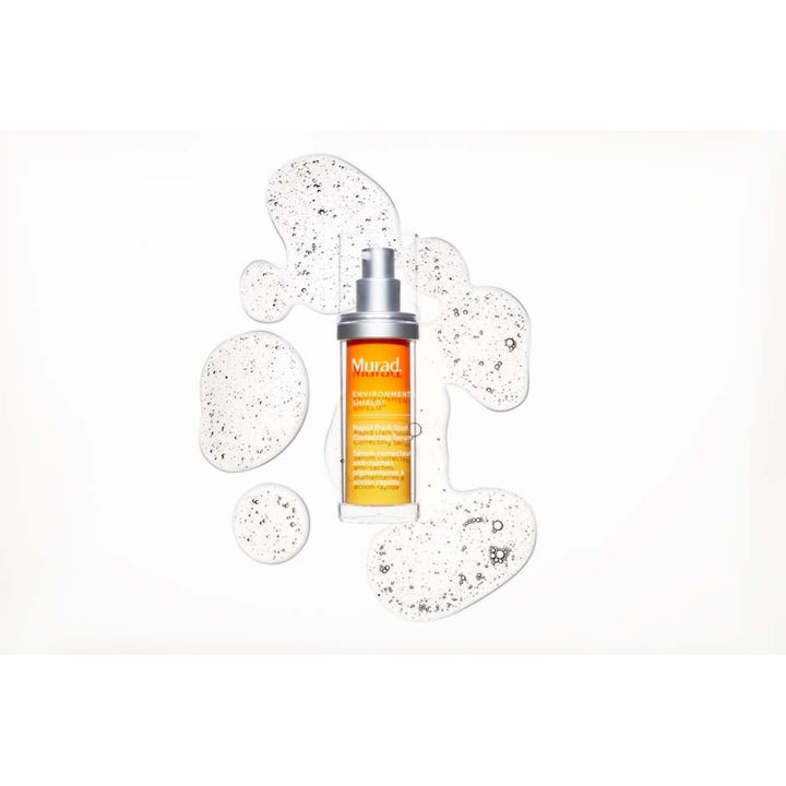 Murad Spot Corrector 80 ml mot pigmentflekker i oransje pumpeflaske vist med en klar boblende geltekstur.