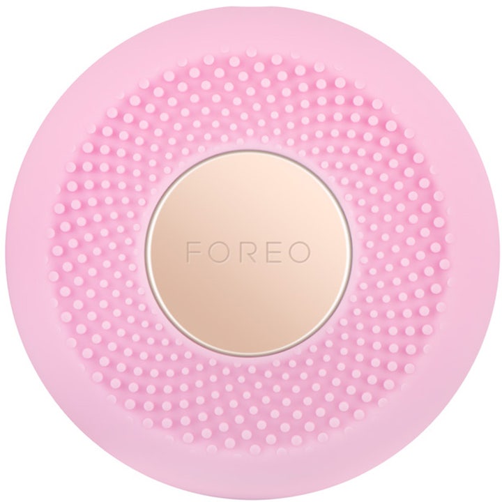 Foreo UFO 1 stk ansiktsbehandling som gir glød i rosa silikon med teksturerte nupper og en sirkulær gullplate